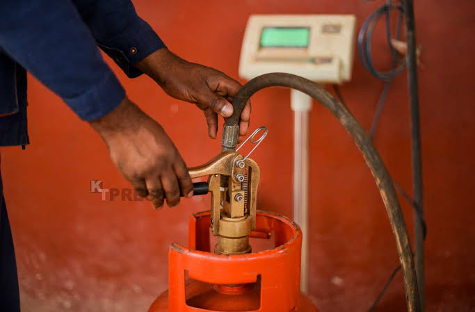 Gas worker filling a cylinder